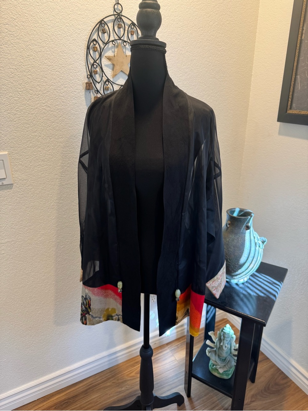 Black Sheer Silk Open-Front Jacket with Multicolor Hem.
